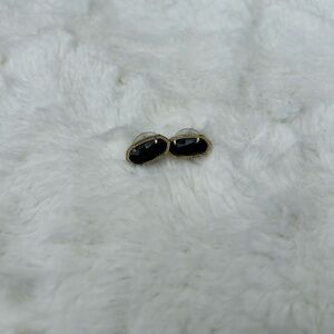 Kendra Scott stud earrings — black and gold color